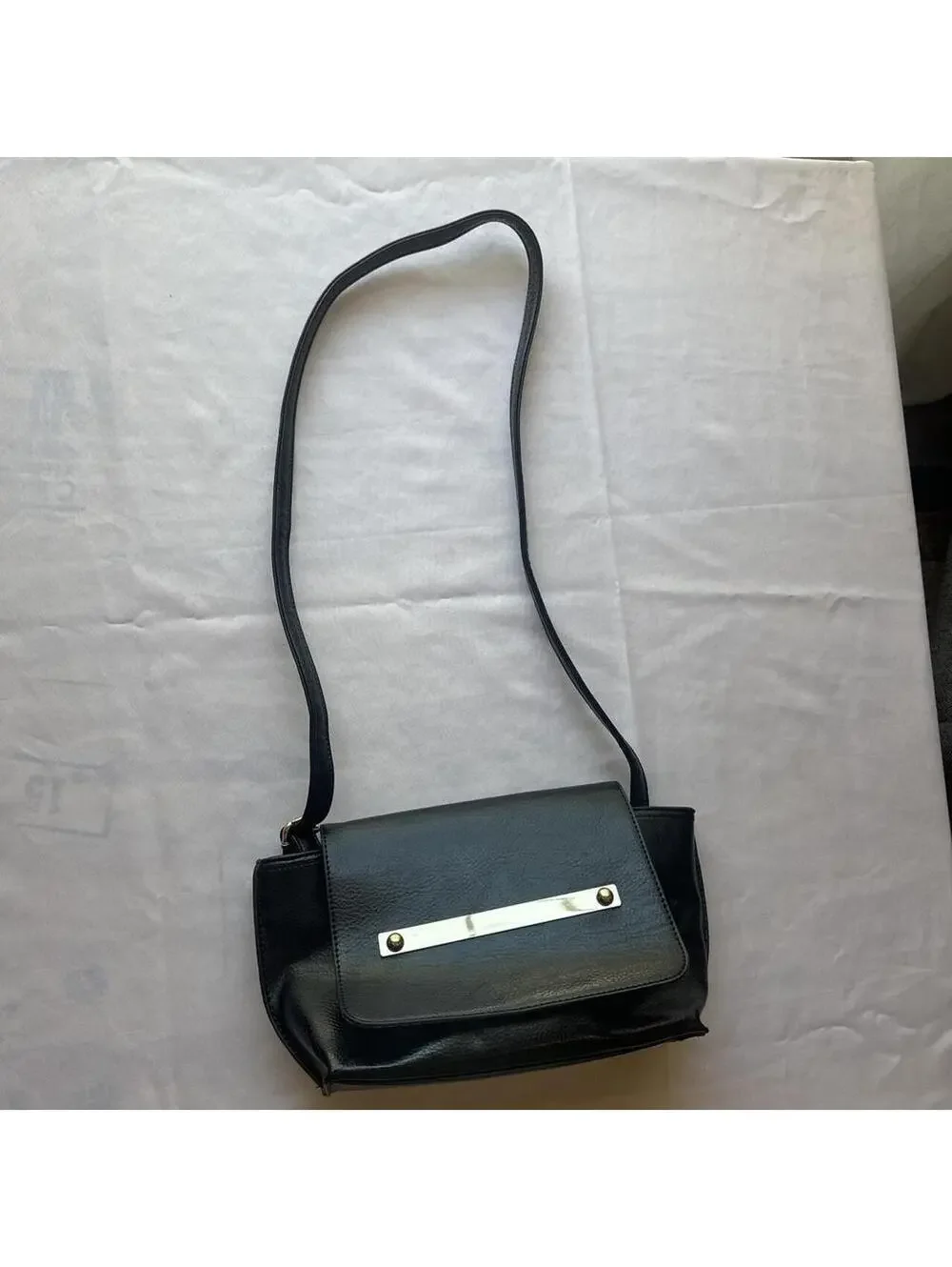 Black Faux Leather Shoulder Bag with Metal Accent and Patterned Interior